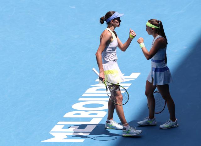 (260131) -- MELBOURNE, Jan. 31, 2026 (Xinhua) -- Anna Danilina (L)/Aleksandra Krunic react during the women's doubles final match between Zhang Shuai (China)/Elise Mertens (Belgium) and Anna Danilina (Kazakhstan)/Aleksandra Krunic (Serbia) at the Australian Open tennis tournament in Melbourne, Australia, Jan. 31, 2026. (Xinhua/Ma Ping)