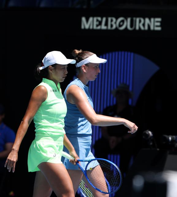(260131) -- MELBOURNE, Jan. 31, 2026 (Xinhua) -- Zhang Shuai (L)/Elise Mertens react during the women's doubles final match between Zhang Shuai (China)/Elise Mertens (Belgium) and Anna Danilina (Kazakhstan)/Aleksandra Krunic (Serbia) at the Australian Open tennis tournament in Melbourne, Australia, Jan. 31, 2026. (Xinhua/Ma Ping)