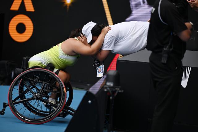 (260131) -- MELBOURNE, Jan. 31, 2026 (Xinhua) -- Li Xiaohui (L) celebrates with her coach after winning the women's wheelchair singles final between Li Xiaohui of China and Diede De Groot of the Netherlands at the Australian Open tennis tournament in Melbourne, Australia, Jan. 31, 2026. (Photo by Wang Shen/Xinhua)