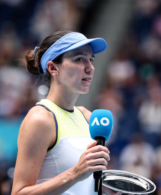 (260131) -- MELBOURNE, Jan. 31, 2026 (Xinhua) -- Anna Danilina delivers a speech during the awarding ceremony for the women's doubles final match between Zhang Shuai (China)/Elise Mertens (Belgium) and Anna Danilina (Kazakhstan)/Aleksandra Krunic (Serbia) at the Australian Open tennis tournament in Melbourne, Australia, Jan. 31, 2026. (Xinhua/Ma Ping)