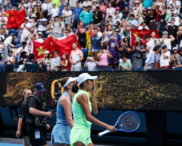 (260131) -- MELBOURNE, Jan. 31, 2026 (Xinhua) -- Zhang Shuai (1st R)/Elise Mertens (2nd R) celebrate winning the women's doubles final match between Zhang Shuai (China)/Elise Mertens (Belgium) and Anna Danilina (Kazakhstan)/Aleksandra Krunic (Serbia) at the Australian Open tennis tournament in Melbourne, Australia, Jan. 31, 2026. (Xinhua/Ma Ping)
