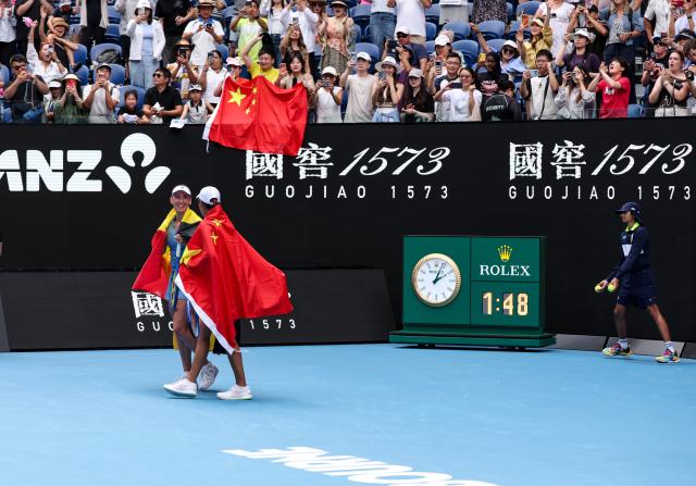 (260131) -- MELBOURNE, Jan. 31, 2026 (Xinhua) -- Zhang Shuai (front C)/Elise Mertens (front L) celebrate winning the women's doubles final match between Zhang Shuai (China)/Elise Mertens (Belgium) and Anna Danilina (Kazakhstan)/Aleksandra Krunic (Serbia) at the Australian Open tennis tournament in Melbourne, Australia, Jan. 31, 2026. (Xinhua/Ma Ping)