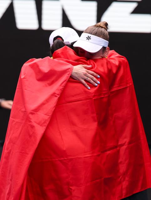 (260131) -- MELBOURNE, Jan. 31, 2026 (Xinhua) -- Zhang Shuai (front)/Elise Mertens celebrate winning the women's doubles final match between Zhang Shuai (China)/Elise Mertens (Belgium) and Anna Danilina (Kazakhstan)/Aleksandra Krunic (Serbia) at the Australian Open tennis tournament in Melbourne, Australia, Jan. 31, 2026. (Xinhua/Ma Ping)