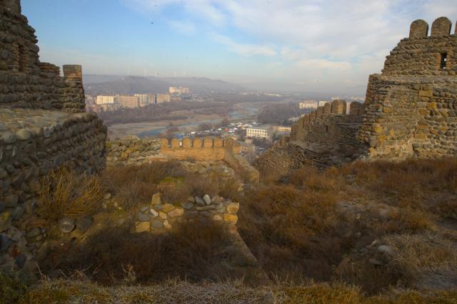 (260131) -- GORI, Jan. 31, 2026 (Xinhua) -- This photo taken on Jan. 30, 2026 shows a view of Gori city and the surrounding river valley as seen from Gori Fortress in Gori, Georgia. Inscribed on Georgia's Immovable Cultural Monuments of National Significance List, Gori Fortress is an important historic site located on a rocky hill in the city of Gori. The castle was originally built in the 6th-7th centuries, took its current form by the 18th century, and was severely damaged by an earthquake in 1920. (Xinhua/Chen Junfeng)