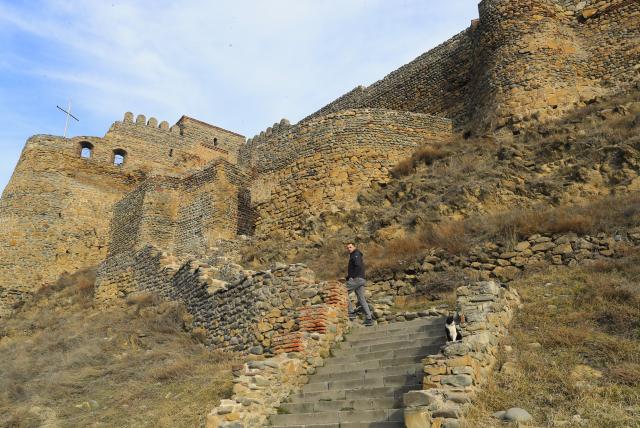 (260131) -- GORI, Jan. 31, 2026 (Xinhua) -- A visitor is seen at Gori Fortress in Gori, Georgia, Jan. 30, 2026. Inscribed on Georgia's Immovable Cultural Monuments of National Significance List, Gori Fortress is an important historic site located on a rocky hill in the city of Gori. The castle was originally built in the 6th-7th centuries, took its current form by the 18th century, and was severely damaged by an earthquake in 1920. (Xinhua/Chen Junfeng)