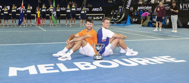 (260131) -- MELBOURNE, Jan. 31, 2026 (Xinhua) -- Christian Harrison (L)/Neal Skupski pose for photos with the trophy during the awarding ceremony for the men's doubles final match between Jason Kubler/Marc Polmans (Australia) and Christian Harrison (the United States)/Neal Skupski (Britain) at the Australian Open tennis tournament in Melbourne, Australia, Jan. 31, 2026. (Photo by Hu Jingchen/Xinhua)