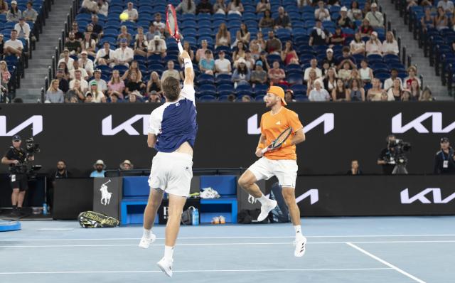(260131) -- MELBOURNE, Jan. 31, 2026 (Xinhua) -- Christian Harrison/Neal Skupski (L) compete during the men's doubles final match between Jason Kubler/Marc Polmans (Australia) and Christian Harrison (the United States)/Neal Skupski (Britain) at the Australian Open tennis tournament in Melbourne, Australia, Jan. 31, 2026. (Photo by Hu Jingchen/Xinhua)