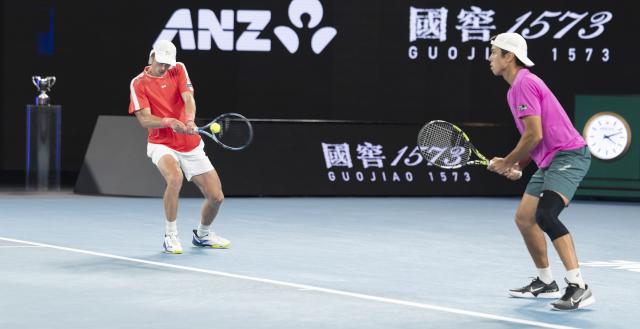 (260131) -- MELBOURNE, Jan. 31, 2026 (Xinhua) -- Jason Kubler/Marc Polmans (L) compete during the men's doubles final match between Jason Kubler/Marc Polmans (Australia) and Christian Harrison (the United States)/Neal Skupski (Britain) at the Australian Open tennis tournament in Melbourne, Australia, Jan. 31, 2026. (Photo by Hu Jingchen/Xinhua)