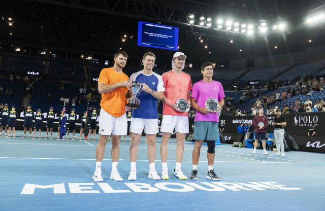(260131) -- MELBOURNE, Jan. 31, 2026 (Xinhua) -- Gold medalists Christian Harrison (1st L)/Neal Skupski (2nd L) and silver medalists Jason Kubler (1st R)/Marc Polmans pose for photos during the awarding ceremony for the men's doubles final match between Jason Kubler/Marc Polmans (Australia) and Christian Harrison (the United States)/Neal Skupski (Britain) at the Australian Open tennis tournament in Melbourne, Australia, Jan. 31, 2026. (Photo by Hu Jingchen/Xinhua)