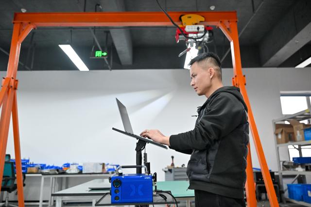 (260131) -- TIANJIN, Jan. 31, 2026 (Xinhua) -- An engineer tests an industrial sensor at Tianjin SIASUN Intelligent Technology Co., Ltd. in the Beijing-Tianjin Zhongguancun Tech Town, in Tianjin, north China, Jan. 30, 2026.
  As a key cooperation platform for Beijing and Tianjin to jointly implement the national strategy for the coordinated development of Beijing-Tianjin-Hebei region, the Beijing-Tianjin Zhongguancun Tech Town has registered a total of 2,060 entities of various types, realizing a combined annual production value of 1.873 billion yuan, or about 271 million U.S. dollars in 2025, a year-on-year growth of 15.62 percent. (Xinhua/Sun Fanyue)