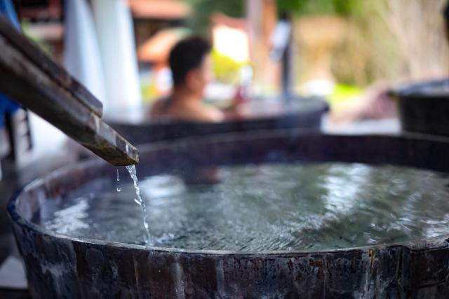 (260131) -- SHIQIAN, Jan. 31, 2026 (Xinhua) -- A tourist enjoys leisure time at a hot spring resort in Shiqian County, southwest China's Guizhou Province, Jan. 27, 2026. By integrating its rich hot spring resources with tourism, healthcare, and intangible cultural heritage, Shiqian county has boosted local tourism and created employment opportunities, making it an important driving force of rural revitalization. (Xinhua/Liu Xu)