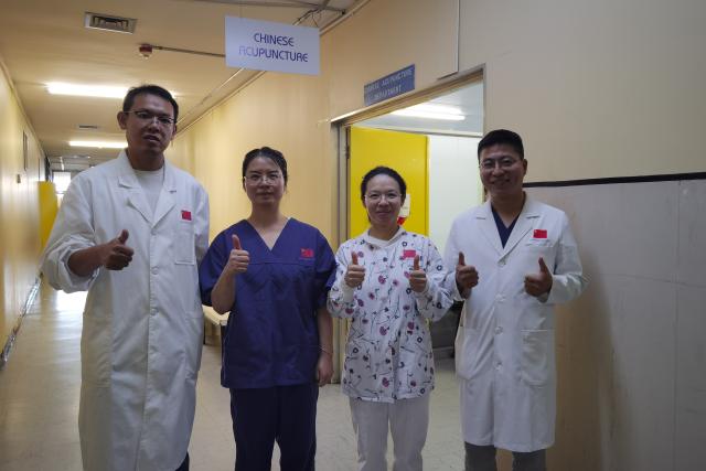 (260131) -- WINDHOEK, Jan. 31, 2026 (Xinhua) -- Four members of the 16th batch of the China Medical Team in Namibia pose for a photo at the Chinese Acupuncture Clinic at Katutura Intermediate Hospital in Windhoek, Namibia, on Jan. 28, 2026. The Chinese Acupuncture Clinic is combining acupuncture with traditional Chinese exercise methods to help improve the health of local residents.
   TO GO WITH "Feature: Needles and Qigong: Chinese medical team brings holistic healing to Namibia" (Photo by Ndalimpinga Iita/Xinhua)