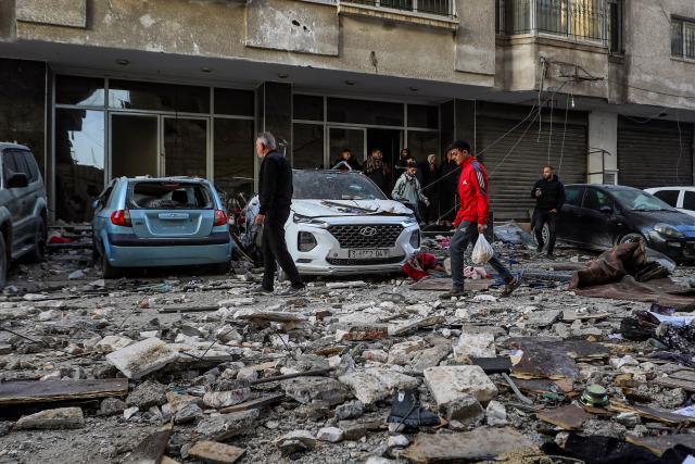 (260131) -- GAZA, Jan. 31, 2026 (Xinhua) -- Palestinians check the damage following Israeli airstrikes in Gaza City, on Jan. 31, 2026. At least 12 people were killed in Israeli airstrikes on Gaza on Saturday, multiple sources reported, citing hospital officials in the enclave. (Photo by Rizek Abdeljawad/Xinhua)