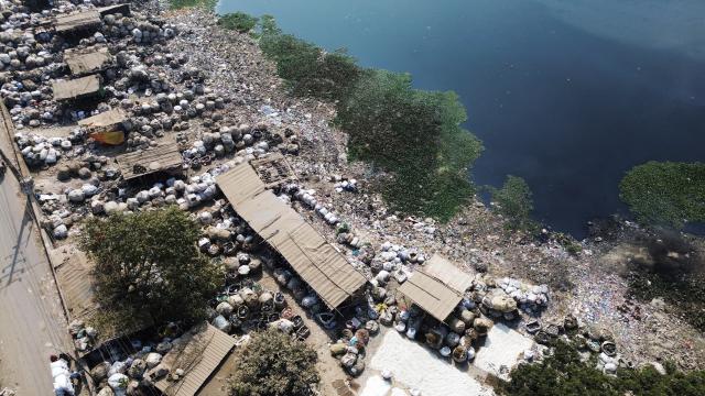 (260201) -- DHAKA, Feb. 1, 2026 (Xinhua) -- An aerial drone photo taken on Jan. 31, 2026 shows plastic waste being stacked and sorted along the banks of the Buriganga River in Dhaka, Bangladesh. (Photo by Habibur Rahman/Xinhua)