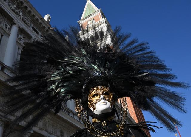 (260201) -- BEIJING, Feb. 1, 2026 (Xinhua) -- A reveler poses at St. Mark's Square during the Venice Carnival 2026 in Venice, Italy, Jan. 31, 2026. The 2026 version of the traditional Venice Carnival runs from Jan. 31 to Feb. 17. (Photo by Alberto Lingria/Xinhua)