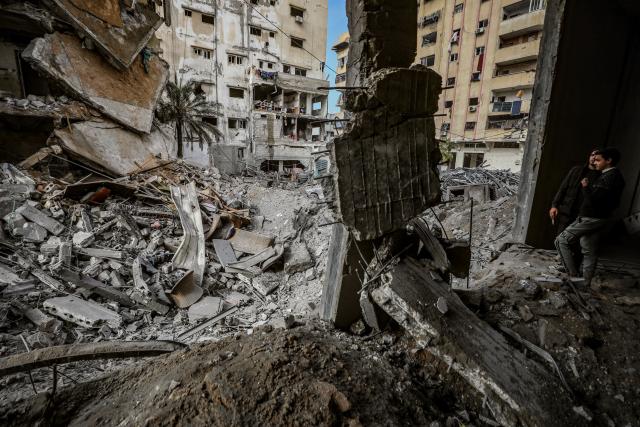 (260201) -- BEIJING, Feb. 1, 2026 (Xinhua) -- Palestinians inspect the damage following Israeli airstrikes in Gaza City, on Jan. 31, 2026. At least 32 Palestinians were killed in a series of Israeli airstrikes across the Gaza Strip late Friday and midday Saturday, Palestinian sources said, with attacks targeting a police station, residential apartments and displacement tents.
   The strikes came as Israel said it was responding to a Hamas breach of the ceasefire, which Hamas rejected as "false and misleading." (Photo by Rizek Abdeljawad/Xinhua)