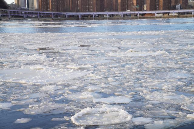 (260201) -- NEW YORK, Feb. 1, 2026 (Xinhua) -- A river is covered with floating ice in New York, the United States, Jan. 31, 2026. In the final week of January, a powerful winter storm swept across much of Canada and the United States, bringing widespread snow, sleet, and freezing rain, along with life-threatening cold and ice. (Xinhua/Zhang Fengguo)