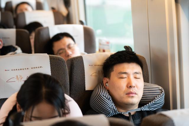 (260201) -- HEFEI, Feb. 1, 2026 (Xinhua) -- Passengers rest at a quiet car on train No. G54 travelling from Hefei, east China's Anhui Province to Beijing, capital of China on Feb. 1, 2026. More than 8,000 high-speed trains across China will provide quiet car services starting from Feb. 1, 2026. (Xinhua/Du Yu)
