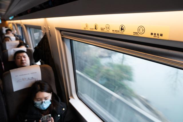 (260201) -- HEFEI, Feb. 1, 2026 (Xinhua) -- Passengers sit at a quiet car on train No. G54 travelling from Hefei, east China's Anhui Province to Beijing, capital of China on Feb. 1, 2026. More than 8,000 high-speed trains across China will provide quiet car services starting from Feb. 1, 2026. (Xinhua/Du Yu)