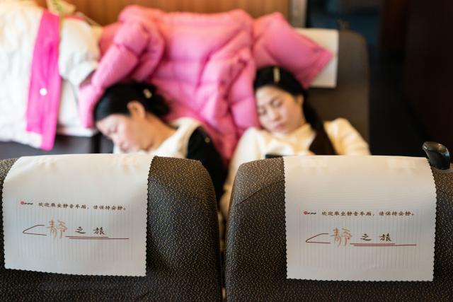 (260201) -- HEFEI, Feb. 1, 2026 (Xinhua) -- Passengers rest at a quiet car on train No. G54 travelling from Hefei, east China's Anhui Province to Beijing, capital of China on Feb. 1, 2026. More than 8,000 high-speed trains across China will provide quiet car services starting from Feb. 1, 2026. (Xinhua/Du Yu)