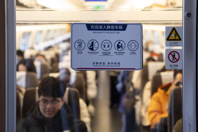 (260201) -- SHANGHAI, Feb. 1, 2026 (Xinhua) -- Passengers sit at a quiet car on train No. G12 travelling from east China's Shanghai to Beijing, capital of China, on Feb. 1, 2026. More than 8,000 high-speed trains across China will provide quiet car services starting from Feb. 1, 2026. (Xinhua/Wang Xiang)
