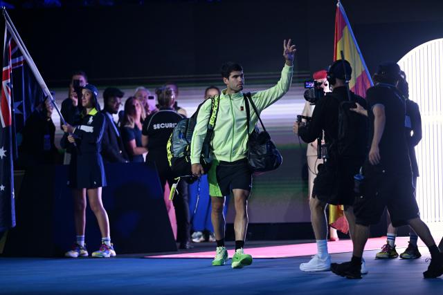 (260201) -- MELBOURNE, Feb. 1, 2026 (Xinhua) -- Carlos Alcaraz enters the court before the men's singles final between Carlos Alcaraz of Spain and Novak Djokovic of Serbia at the Australian Open tennis tournament in Melbourne, Australia, Feb. 1, 2026. (Photo by Wang Shen/Xinhua)