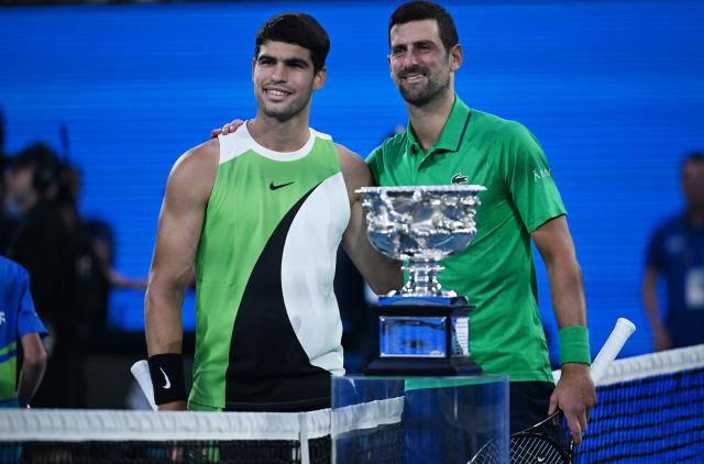 (260201) -- MELBOURNE, Feb. 1, 2026 (Xinhua) -- Carlos Alcaraz (L) and Novak Djokovic take photos before their men's singles final at the Australian Open tennis tournament in Melbourne, Australia, Feb. 1, 2026. (Photo by Wang Shen/Xinhua)