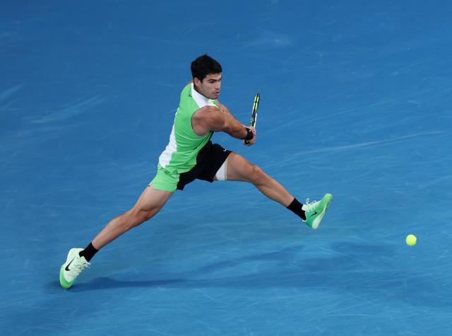 (260201) -- MELBOURNE, Feb. 1, 2026 (Xinhua) -- Carlos Alcaraz hits a return during the men's singles final between Carlos Alcaraz of Spain and Novak Djokovic of Serbia at the Australian Open tennis tournament in Melbourne, Australia, Feb. 1, 2026. (Xinhua/Ma Ping)