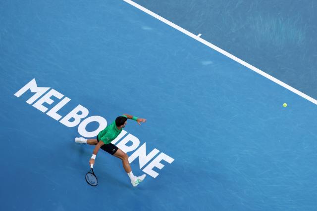 (260201) -- MELBOURNE, Feb. 1, 2026 (Xinhua) -- Novak Djokovic hits a return during the men's singles final between Carlos Alcaraz of Spain and Novak Djokovic of Serbia at the Australian Open tennis tournament in Melbourne, Australia, Feb. 1, 2026. (Xinhua/Ma Ping)