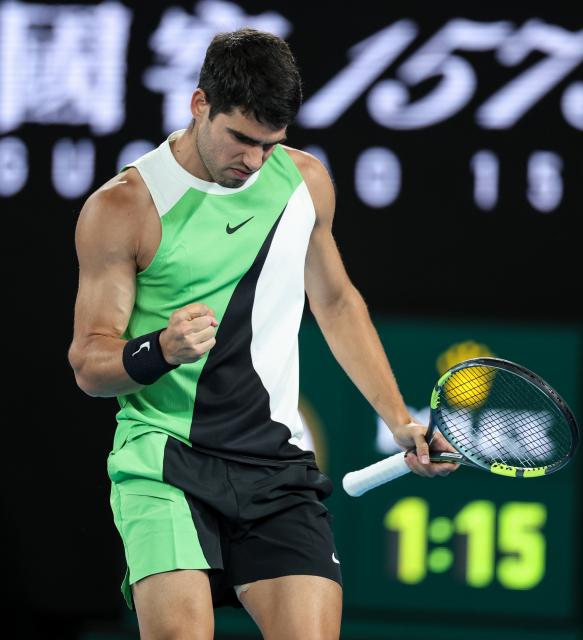 (260201) -- MELBOURNE, Feb. 1, 2026 (Xinhua) -- Carlos Alcaraz celebrates scoring during the men's singles final between Carlos Alcaraz of Spain and Novak Djokovic of Serbia at the Australian Open tennis tournament in Melbourne, Australia, Feb. 1, 2026. (Xinhua/Ma Ping)