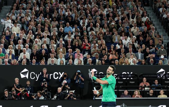 (260201) -- MELBOURNE, Feb. 1, 2026 (Xinhua) -- Novak Djokovic claps for Carlos Alcaraz during the men's singles final between Carlos Alcaraz of Spain and Novak Djokovic of Serbia at the Australian Open tennis tournament in Melbourne, Australia, Feb. 1, 2026. (Xinhua/Ma Ping)
