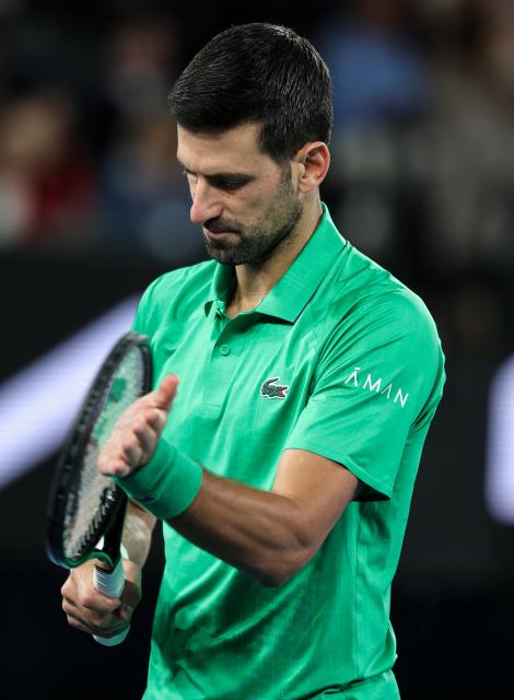(260201) -- MELBOURNE, Feb. 1, 2026 (Xinhua) -- Novak Djokovic claps for Carlos Alcaraz during the men's singles final between Carlos Alcaraz of Spain and Novak Djokovic of Serbia at the Australian Open tennis tournament in Melbourne, Australia, Feb. 1, 2026. (Xinhua/Ma Ping)