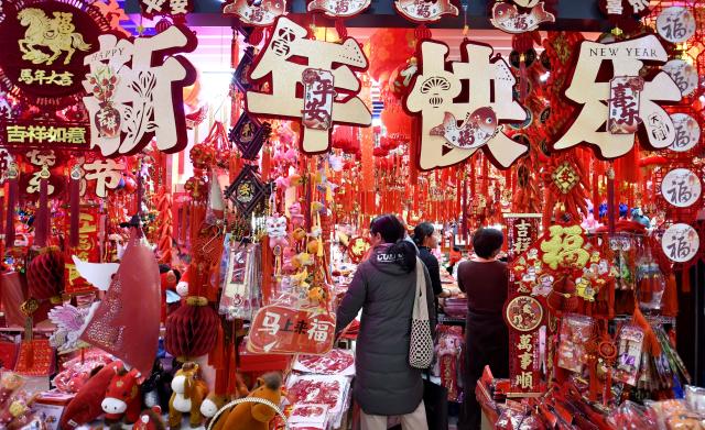 (260201) -- BEIJING, Feb. 1, 2026 (Xinhua) -- People shop for festive decorations at a shopping mall in Beijing, capital of China, Jan. 31, 2026. With the approach of the Spring Festival, shopping malls across Beijing have begun selling festive decorations. (Xinhua/Li Xin)