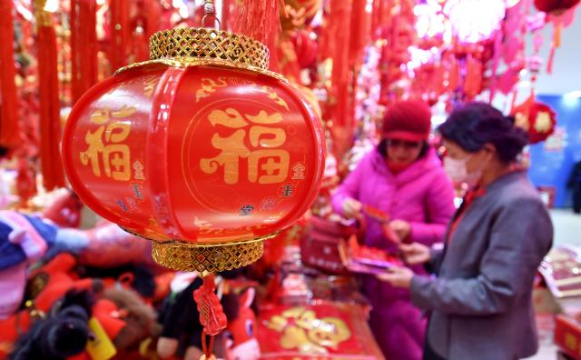 (260201) -- BEIJING, Feb. 1, 2026 (Xinhua) -- People shop for festive decorations at a shopping mall in Beijing, capital of China, Jan. 31, 2026. With the approach of the Spring Festival, shopping malls across Beijing have begun selling festive decorations. (Xinhua/Li Xin)