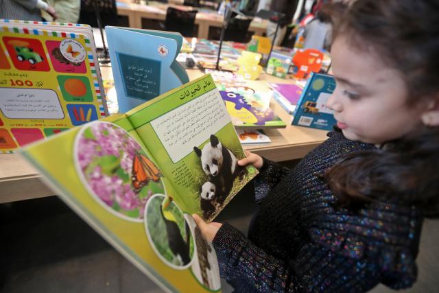 (260201) -- BEIRUT, Feb. 1, 2026 (Xinhua) -- A child reads at the 2026 Children's Book Fair held at the National Library in Beirut, Lebanon, Jan. 31, 2026. (Photo by Bilal Jawich/Xinhua)