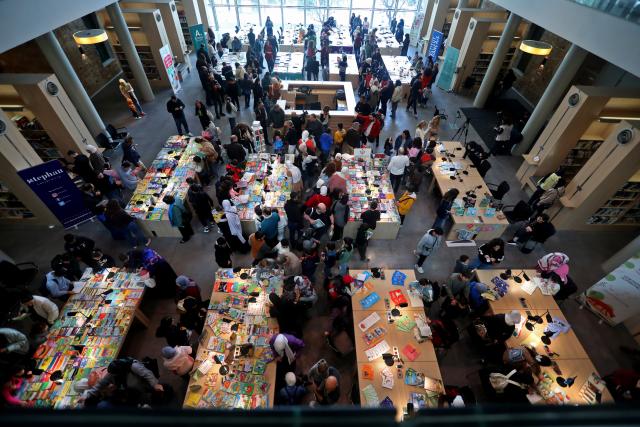 (260201) -- BEIRUT, Feb. 1, 2026 (Xinhua) -- Children read at the 2026 Children's Book Fair held at the National Library in Beirut, Lebanon, Jan. 31, 2026. (Photo by Bilal Jawich/Xinhua)
