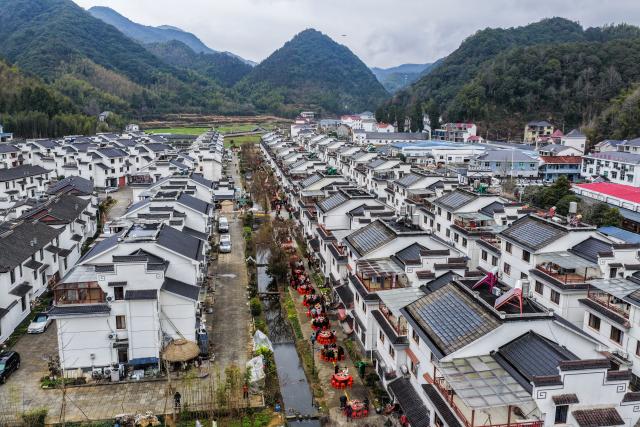 (260201) -- JIANDE, Feb. 1, 2026 (Xinhua) -- An aerial drone photo taken on Feb. 1, 2026 shows people dining on the street in Lianhua Township, east China's Zhejiang Province. A Spring Festival cultural event was held here with great enthusiasm on Sunday. Local residents and tourists enjoyed the festive market, viewed the local art exhibition, participated in traditional games, and savored local foods. (Xinhua/Xu Yu)