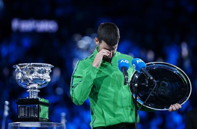 (260201) -- MELBOURNE, Feb. 1, 2026 (Xinhua) -- Novak Djokovic reacts at the awarding ceremony after the men's singles final between Carlos Alcaraz of Spain and Novak Djokovic of Serbia at the Australian Open tennis tournament in Melbourne, Australia, Feb. 1, 2026. (Photo by Wang Shen/Xinhua)