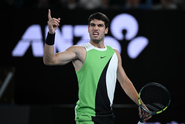 (260201) -- MELBOURNE, Feb. 1, 2026 (Xinhua) -- Carlos Alcaraz celebrates scoring during the men's singles final between Carlos Alcaraz of Spain and Novak Djokovic of Serbia at the Australian Open tennis tournament in Melbourne, Australia, Feb. 1, 2026. (Photo by Wang Shen/Xinhua)