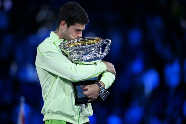 (260201) -- MELBOURNE, Feb. 1, 2026 (Xinhua) -- Carlos Alcaraz celebrates with the trophy after winning the men's singles final between Carlos Alcaraz of Spain and Novak Djokovic of Serbia at the Australian Open tennis tournament in Melbourne, Australia, Feb. 1, 2026. (Photo by Wang Shen/Xinhua)