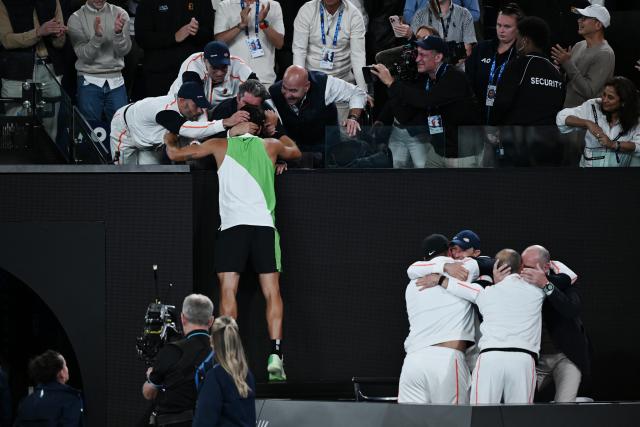 (260201) -- MELBOURNE, Feb. 1, 2026 (Xinhua) -- Carlos Alcaraz celebrates with his team after winning the men's singles final between Carlos Alcaraz of Spain and Novak Djokovic of Serbia at the Australian Open tennis tournament in Melbourne, Australia, Feb. 1, 2026. (Photo by Wang Shen/Xinhua)
