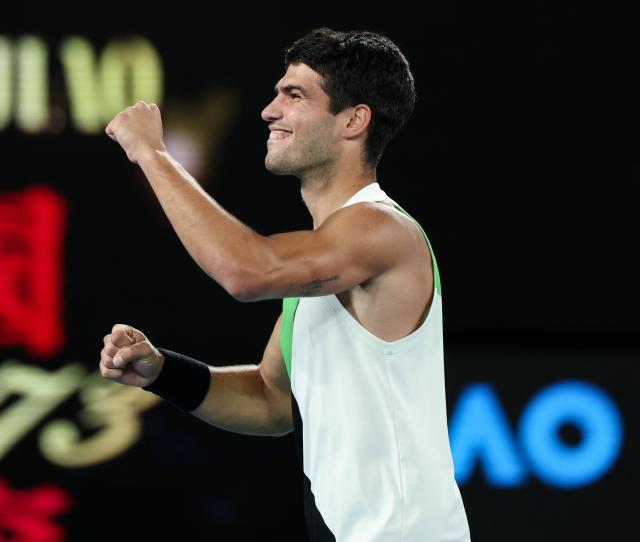 (260201) -- MELBOURNE, Feb. 1, 2026 (Xinhua) -- Carlos Alcaraz celebrates after winning the men's singles final between Carlos Alcaraz of Spain and Novak Djokovic of Serbia at the Australian Open tennis tournament in Melbourne, Australia, Feb. 1, 2026. (Xinhua/Ma Ping)