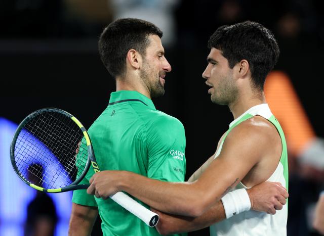(260201) -- MELBOURNE, Feb. 1, 2026 (Xinhua) -- Carlos Alcaraz (R) greets Novak Djokovic after the men's singles final between Carlos Alcaraz of Spain and Novak Djokovic of Serbia at the Australian Open tennis tournament in Melbourne, Australia, Feb. 1, 2026. (Xinhua/Ma Ping)