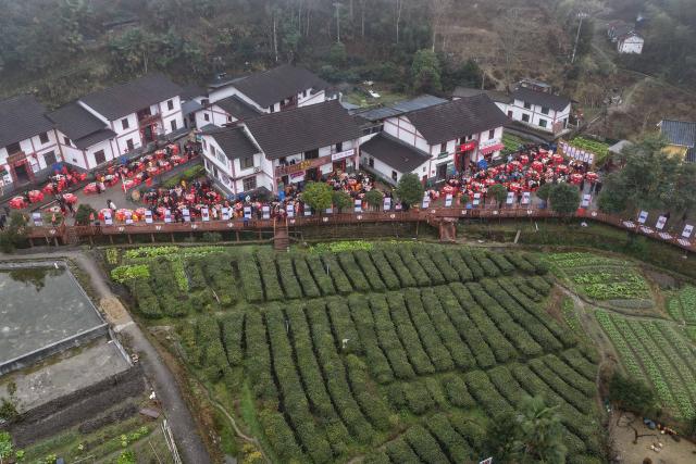(260201) -- JINGGANGSHAN, Feb. 1, 2026 (Xinhua) -- This aerial drone photo taken on Feb. 1, 2026 shows a banquet held during the Spring Festival gala in Shenshan Village, Jinggangshan City of east China's Jiangxi Province. With the Spring Festival drawing near, Shenshan Village in Jinggangshan City held a Spring Festival gala that invited residents from seven nearby counties in east China's Jiangxi and central China's Hunan provinces to participate. (Xinhua/Zhou Mi)