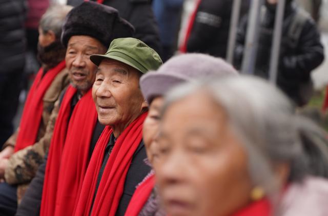 (260201) -- JINGGANGSHAN, Feb. 1, 2026 (Xinhua) -- Villagers take part in a festive gathering held during the Spring Festival gala in Shenshan Village, Jinggangshan City of east China's Jiangxi Province, Feb. 1, 2026. With the Spring Festival drawing near, Shenshan Village in Jinggangshan City held a Spring Festival gala that invited residents from seven nearby counties in east China's Jiangxi and central China's Hunan provinces to participate. (Xinhua/Zhou Mi)
