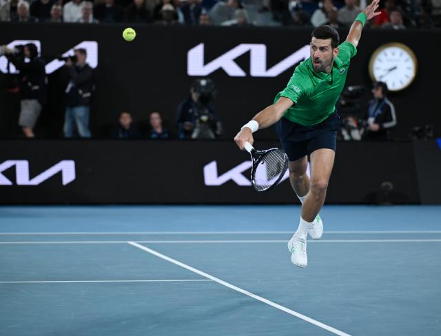 (260201) -- MELBOURNE, Feb. 1, 2026 (Xinhua) -- Novak Djokovic hits a return during the men's singles final between Carlos Alcaraz of Spain and Novak Djokovic of Serbia at the Australian Open tennis tournament in Melbourne, Australia, Feb. 1, 2026. (Photo by Wang Shen/Xinhua)