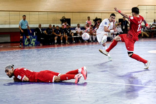 (260201) -- JAKARTA, Feb. 1, 2026 (Xinhua) -- Behrooz Azimihematabadi (C) of Iran kicks the ball during the Group D match between Iran and Afghanistan at the AFC Futsal Asian Cup 2026 in Jakarta, Indonesia, Feb. 1, 2026. (Xinhua/Agung Kuncahya B.)