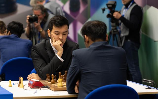 (260202) -- WIJK AAN ZEE, Feb. 2, 2026 (Xinhua) -- Nodirbek Abdusattorov (L) of Uzbekistan competes during the Tata Steel Chess Tournament in Wijk aan Zee, the Netherlands, Feb. 1, 2026. (Photo by Sylvia Lederer/Xinhua)