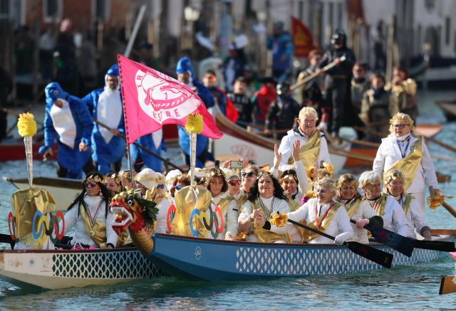 (260202) -- VENICE, Feb. 2, 2026 (Xinhua) -- Revelers dress up in theme of the Olympic Games during the water parade of Venice Carnival in Venice, Italy, Feb. 1, 2026. The 2026 version of the traditional Venice Carnival runs from Jan. 31 to Feb. 17. (Xinhua/Li Jing)