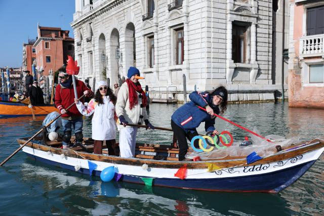 (260202) -- VENICE, Feb. 2, 2026 (Xinhua) -- Revelers dress up in theme of the Olympic Games during the water parade of Venice Carnival in Venice, Italy, Feb. 1, 2026. The 2026 version of the traditional Venice Carnival runs from Jan. 31 to Feb. 17. (Xinhua/Li Jing)
